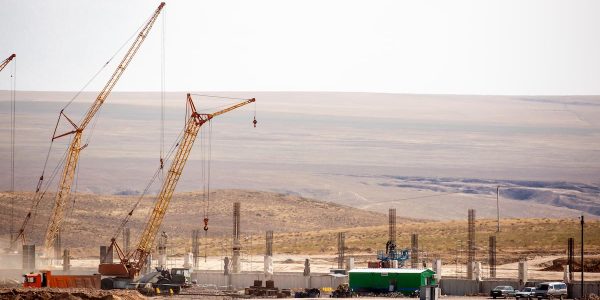 Lifting cranes and other equipment at a construction site.