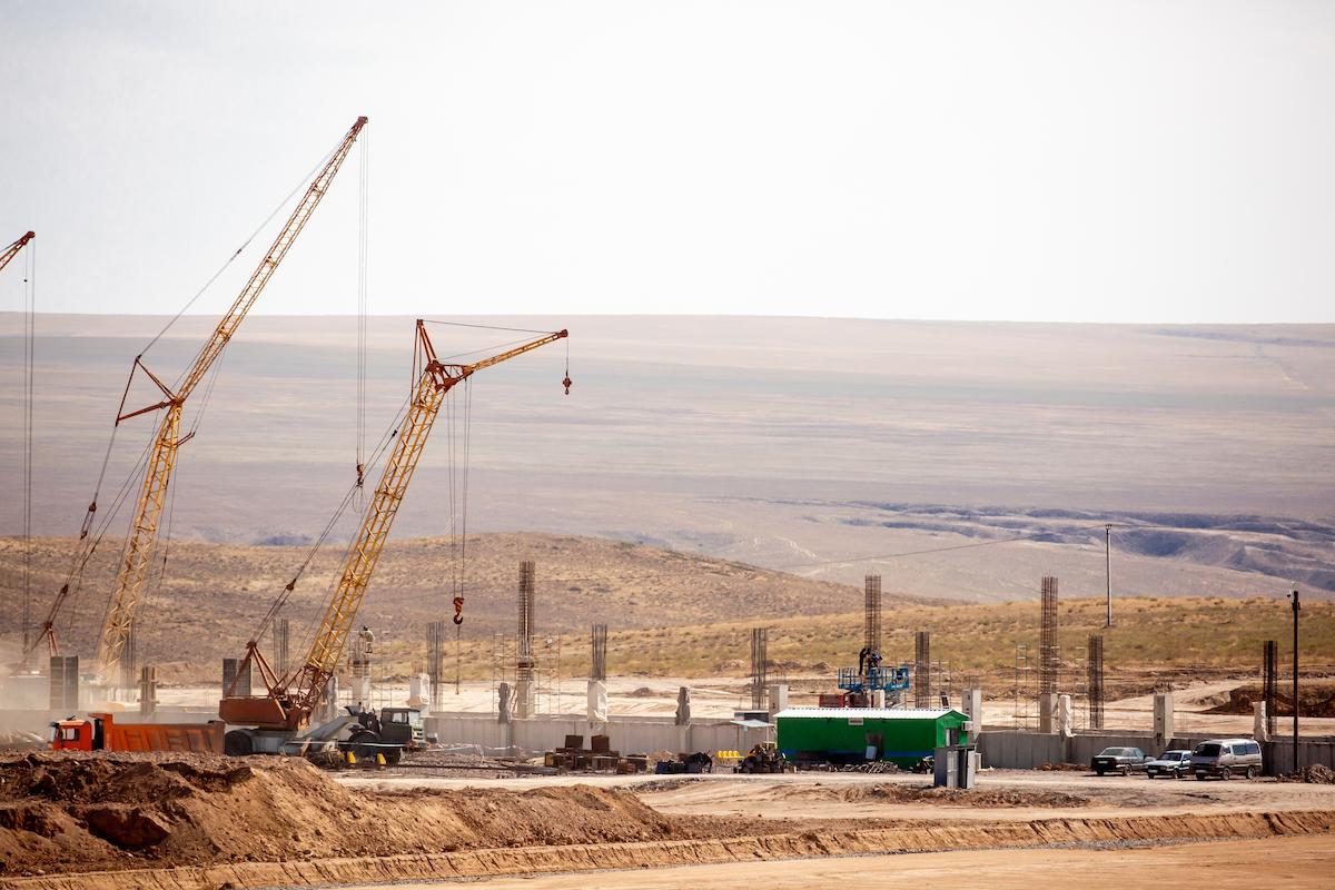 Lifting cranes and other equipment at a construction site.